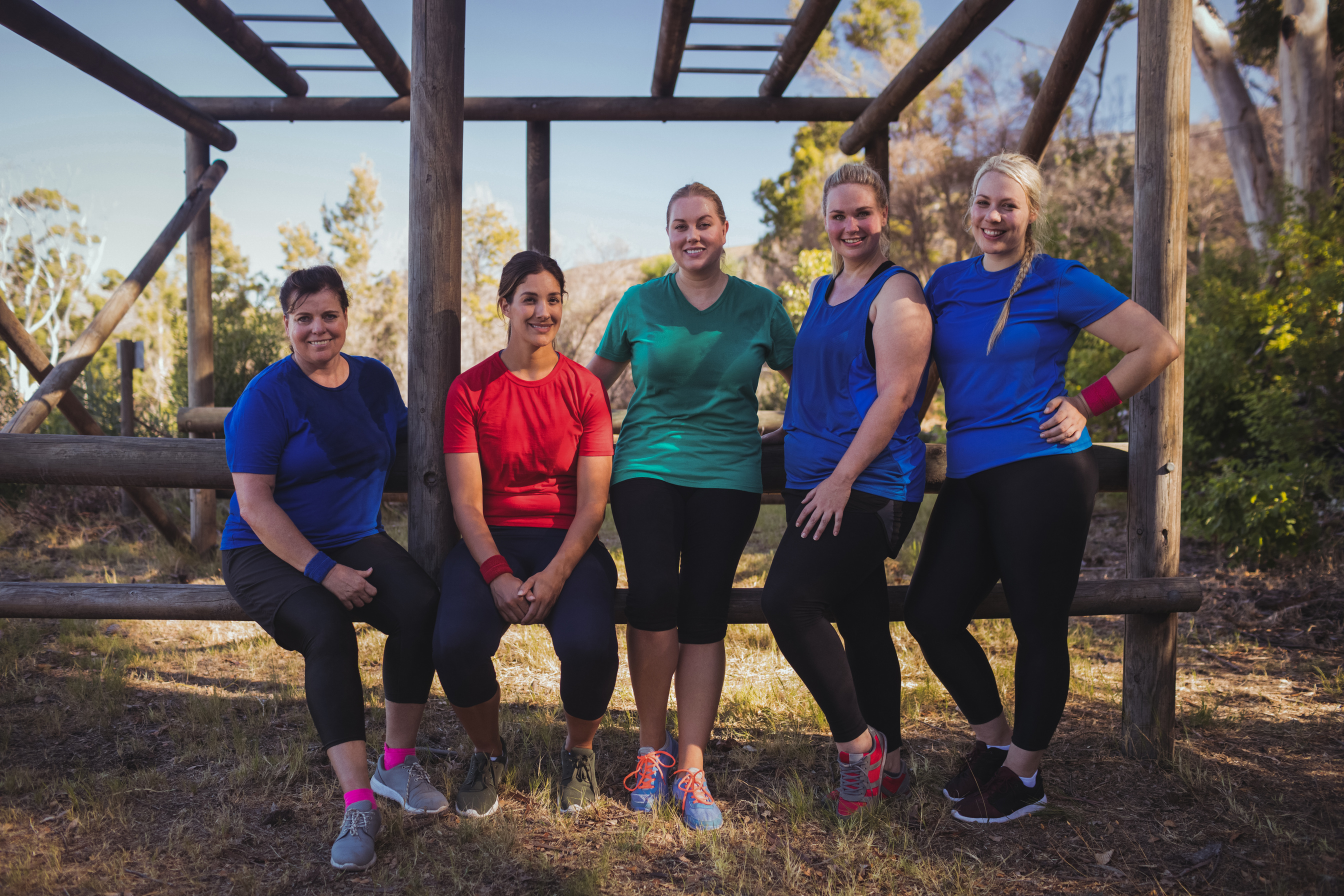 Group of fit women standing together in the boot camp